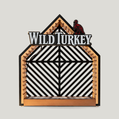 Decorative illuminated bottle glorifier with 'Wild Turkey' branding on a gray background.