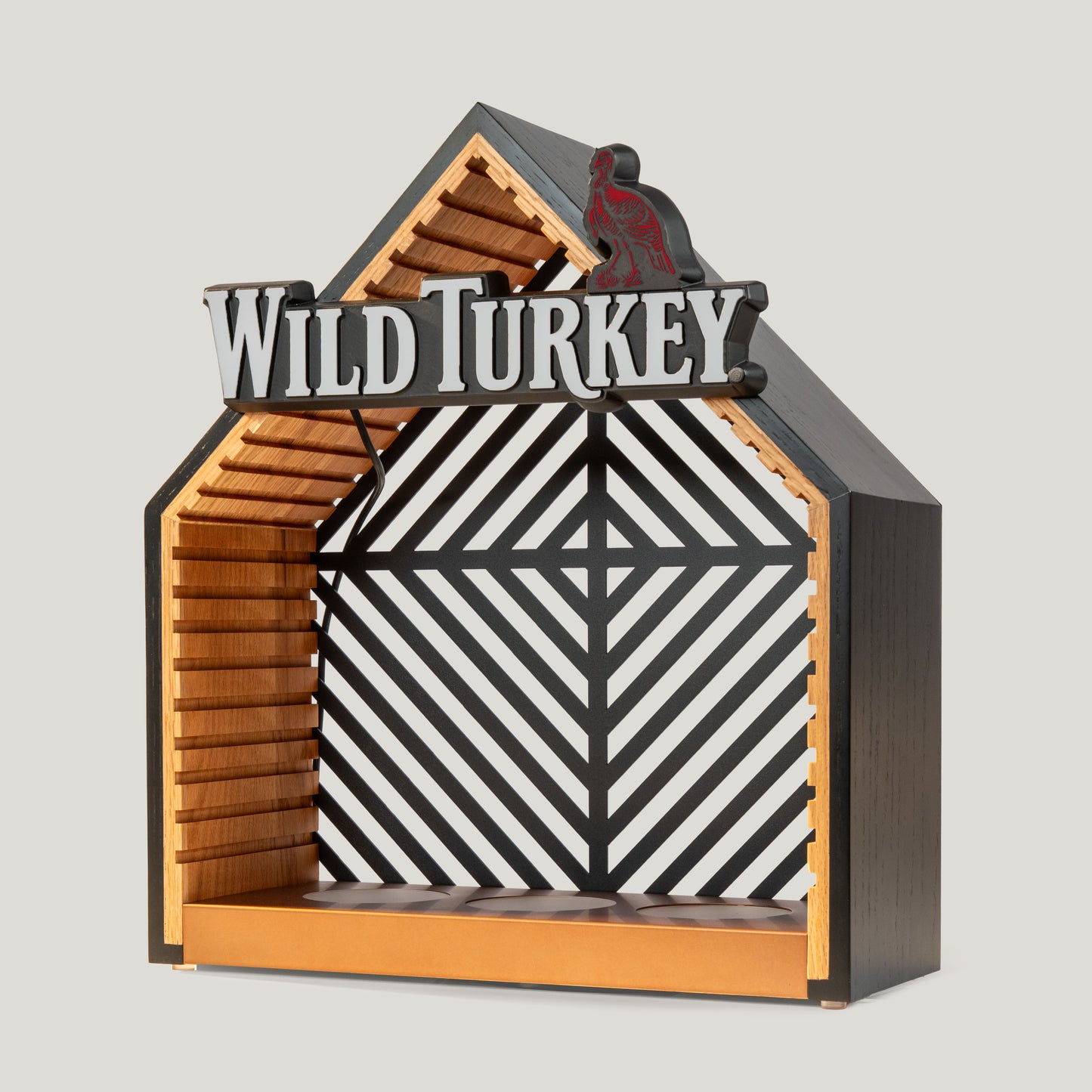 Decorative illuminated bottle glorifier with 'Wild Turkey' branding on a gray background.